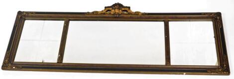 An Edwardian wooden framed gilt mirror, of sectional design, with large rectangular mirror plate to centre and four section etched mirror plate to each side, with an urn and flower finial to the top, 40cm x 120cm.