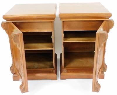 A pair of 19thC oak pedestal cupboards, each moulded top with S scroll and fan pillars, a carved central section, on a block base, the front door opening to reveal two shelves, 97cm high, 64cm wide, 66cm deep. - 2