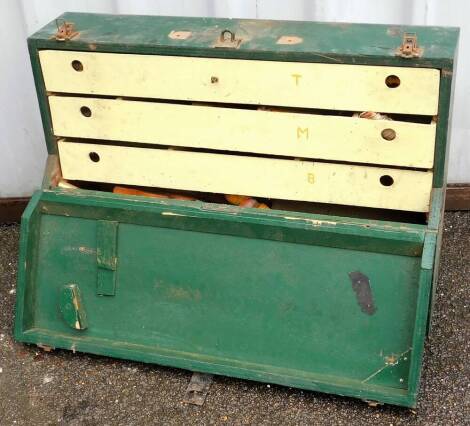 A green painted pine tool chest and contents, to include wooden handled screw drivers, chisels, blocks, etc. (1 box)