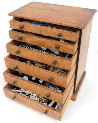 A miniature Hungarian ash chest of drawers and contents, comprising pen nibs, inks, drawing utensils, paints, etc., 45cm high, 38cm wide, 23cm deep. - 2