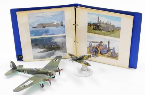 Two Corgi aviation models, to include the Heinkel Heiii, the Corgi Spitfire, stand wheels and aviation photographs. (3)