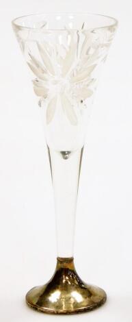 A cut glass champagne flute, on a white metal base, stamped 36066, the top with floral pierced decoration, 20cm high.