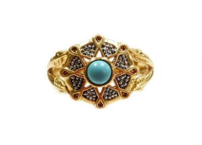 A turquoise and diamond floral cluster ring, with central turquoise stone, and various pave set diamonds, with V design shoulders, on a yellow metal band, unmarked, ring size Q, 5.3g all in.