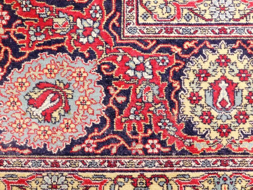 A Tabriz design carpet, the central medallion panel on a red cream