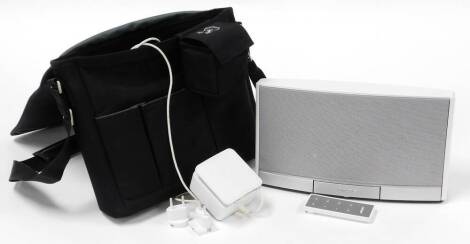 A Bose Sound Dock portable digital music system, with power lead and carry case.