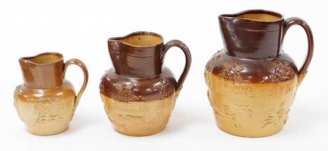 A graduated set of three Royal Doulton style stoneware jugs.