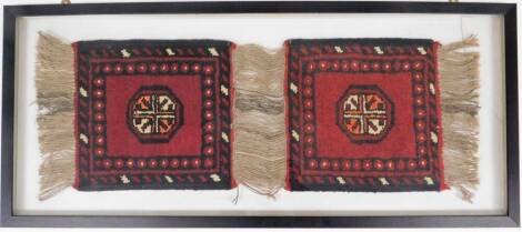 Two Eastern square rugs, each on red ground with central medallion, tassel ends, 30cm x 30cm each, in joint frame. (AF)