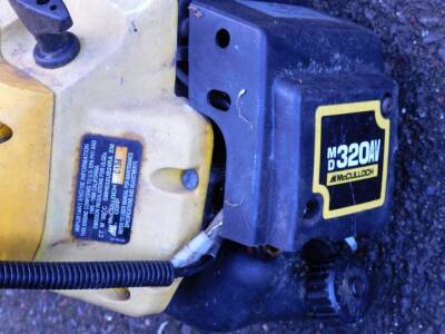 A McCulloch MD 320 AV petrol strimmer. - 2