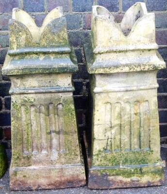 A pair of Victorian stoneware chimney turrets, with anchor stamp and three bowed section on reeded columns, on a flock base, 78cm high, 30cm wide, 30cm deep. (2)