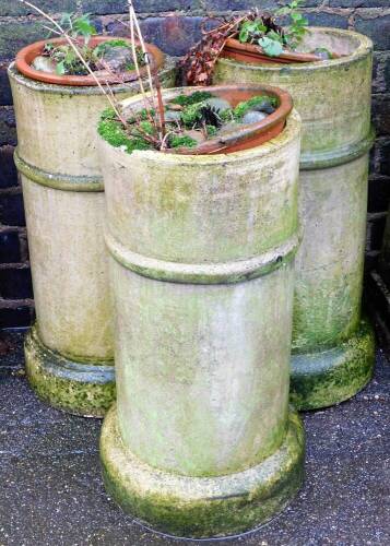 Three stoneware chimney or piping sleeves, 63cm high. (3)