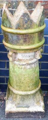 A Victorian stoneware chimney pot, of turret form, on a square foot, 99cm high, 29cm diameter.