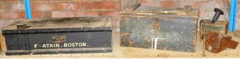 A wooden tool box and contents, to include wooden mallets, chisels, saws, etc, in a black painted pine tool box, stamped F. Atkin, Boston, together with clamp, wooden handled screw drivers, and various other sets, all enclosed in a further pine chest. (2)