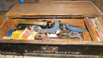 A wooden tool box and contents, to include wooden mallets, chisels, saws, etc, in a black painted pine tool box, stamped F. Atkin, Boston, together with clamp, wooden handled screw drivers, and various other sets, all enclosed in a further pine chest. (2) - 2