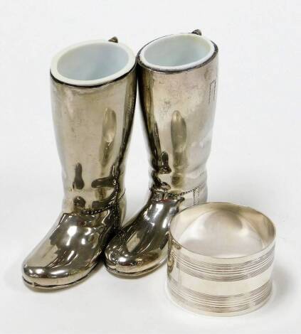 A group of silver and other wares, to include a silver napkin ring, of reeded decoration, stamped sterling silver, together with a pair of silver plated riding boots. (3)