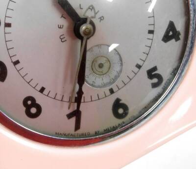 A Metalair Art Deco style clock, with a silver coloured face, in pink Bakelite surround, 16cm high, 15cm wide. - 2