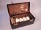 An Edwardian canvas picnic set case containing silver plated fittings to