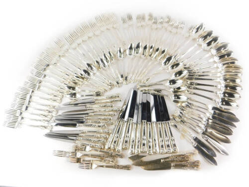 An associated canteen of 19thC and later silver Kings pattern cutlery, comprising an set of twelve dessert spoons, London 1818 by Josiah and George Piercy (22½oz), a set of twelve table forks, London 1823, possibly by William Stroud, (38oz), a set of twel