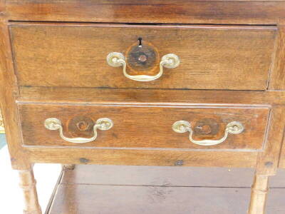 A late 18th/early 19thC oak dresser, the associated raised back with three plate shelves, the base with a moulded edge above an arrangement of five drawers around an arch, on turned supports with pot board and stiles, 200cm high, 177cm wide, 45cm deep. - 3