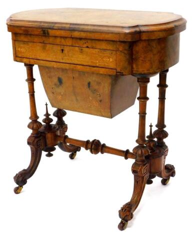 A Victorian walnut games/work table, the quarter veneered top with a burr yew crossbanded border and a moulded edge, inlaid chess, back gammon and cribbage boards in fruitwood and kingwood, above a frieze drawer fitted with compartments for cotton reels a