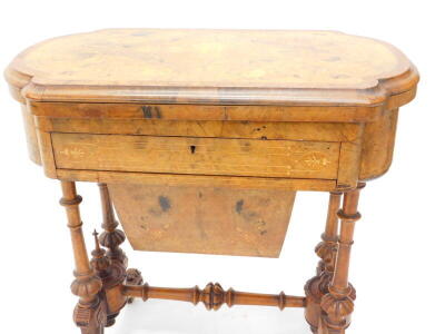 A Victorian walnut games/work table, the quarter veneered top with a burr yew crossbanded border and a moulded edge, inlaid chess, back gammon and cribbage boards in fruitwood and kingwood, above a frieze drawer fitted with compartments for cotton reels a - 2