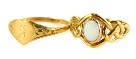 Two dress rings, to include a 9ct gold opal set dress ring, with weave design shoulders, ring size L, together with a thin 9ct gold signet ring, with heart shaped crest bearing the initial J, with scroll design shoulders, ring size Q, 3.3g all in. (2)