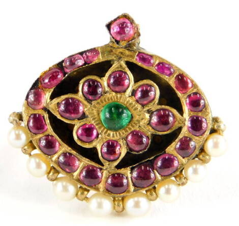 An Indian design dress ring, converted from an oval pendant set with rough cut rubies and emeralds, with cultured pearls, in a silver gilt setting, on a later applied yellow metal band, unmarked, 7.6g all in.