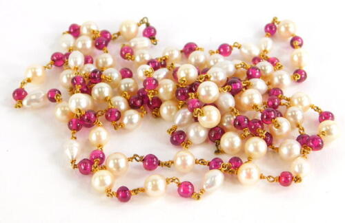 A pearl and garnet longuard necklace, with various blister and cultured pearls, with round beaded garnets, with yellow metal links, unmarked, 62cm long overall, 44.4g all in.