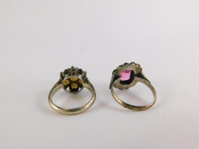 Two silver dress rings, to include an opal floral cluster ring, ring size L, and a 9ct gold and silver garnet and marcasite dress ring, with V splayed shoulders, ring size O½. (2) - 2