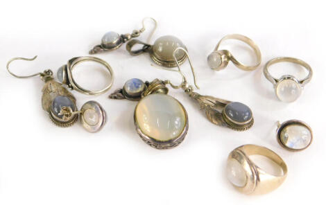 A group of moonstone jewellery, to include a pendant in silver frame, four silver dress rings, two pairs of silver drop earrings, a pair of silver studs and a silver pendant. (9)