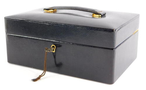 A brown leather Asprey London jewellery box, the box with key lock, metal hinges, single shelf with two lift up compartments, with brown velvet interior, 9cm high, 22cm wide, 15.5cm deep.