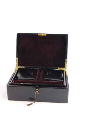 A brown leather Asprey London jewellery box, the box with key lock, metal hinges, single shelf with two lift up compartments, with brown velvet interior, 9cm high, 22cm wide, 15.5cm deep. - 2