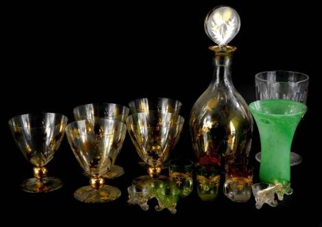 A 20thC decanter and stopper, decorated in gilt with thistles, a set of five matching glasses, a Scottish type green mottled glass vase, coloured glass salts and small cups, etc.