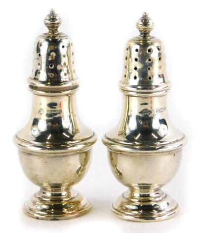 A pair of Elizabeth II silver pepper pots, Birmingham 1961, 1¾oz, 8cm high.