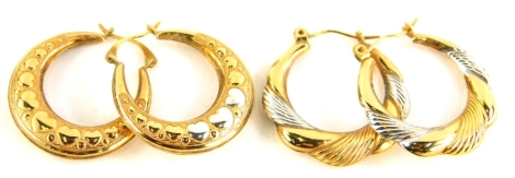 Two pairs of 9ct gold bi-colour hoops, one pair set with three silvered hearts and other heart designs, 2cm wide, and another of pleated design, of bi-colour decoration, 2.4g.