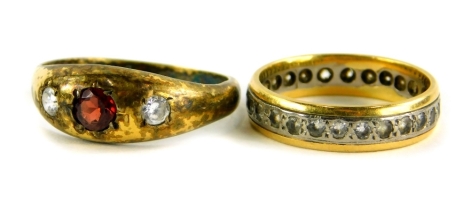 Two dress rings, to include a 9ct gold and silver eternity ring, set with various white stones, ring size P½, and a dress ring stamped silver, set with three paste stones, ring size T½. (2)