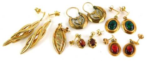 Various pairs of 9ct gold and other earrings, to include a pair of rolled gold ships anchor earrings, a pair of yellow metal thin paste stone set earrings, a pair of 9ct gold and garnet set cluster earrings, a pair of 9ct gold abstract design earrings, an