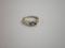 A three stone white and yellow metal ring set with sapphire and