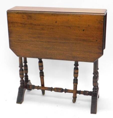 An Edwardian walnut Sutherland table, the rectangular top with canted corners, on turned supports, 60cm wide.