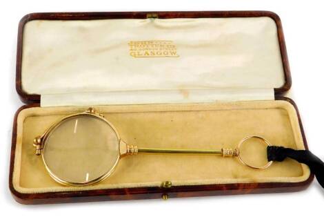 A gilt brass lorgnette, in fitted case stamped John Trotter Limited, Glasgow.