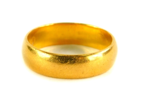 A 22ct gold wedding band, of plain design, ring size K, 4.8g.