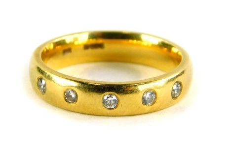 An 18ct gold diamond set half hoop dress ring, set with six illusion set tiny diamonds, ring size J, 4.7g all in.