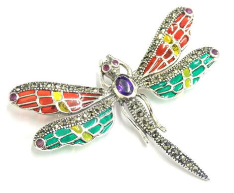 A plique-a-jour butterfly brooch, set with amethyst, rubies and marcasite, with red, yellow and green decoration, silver, 5.5cm wide.