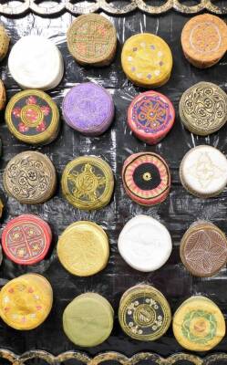 An impressive collection of Kufi hats of various embroidered coloured design, (57), together with a hand made papier mache display panel, 132cm x 229cm. - 4