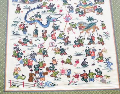 An early 20thC Chinese silk embroidery, of figures and dragons, with a green floral border, in a modern gilt frame, 58cm x 87cm. - 3