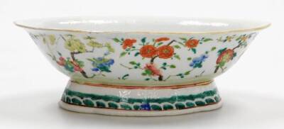 A 19thC Chinese porcelain dish, of shaped oval form and flared foot, in famille rose colours, decorated with trees predominantly in pink, green and blue, on a shaped base, 28cm wide. - 3