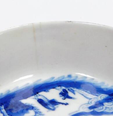 A Chinese blue and white shallow dish, decorated with figures, trees and calligraphy, the exterior with further decoration of the same design, four character hallmark beneath, possibly 18thC, 12cm diameter. - 5