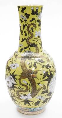 A large 20thC Chinese porcelain vase, with flared neck, decorated with four clawed dragons among peonies and chrysanthemums, on a yellow crackle ground, six character Xianfeng mark beneath, 59cm high. - 4