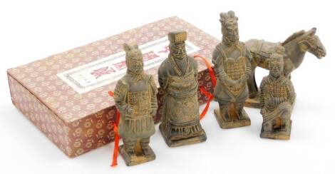 A set of terracotta figures in Han dynasty style, depicting four men and a horse, in presentation box 23cm x 13cm.