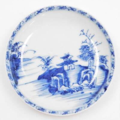 A Nanking cargo blue and white tea bowl and saucer decorated with landscapes, bearing Christie's lot label to underside, possibly numbered 5165, the bowl 6cm diameter, the dish 10cm diameter. (2) - 2