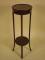 An Edwardian mahogany and boxwood strung two tier plant stand